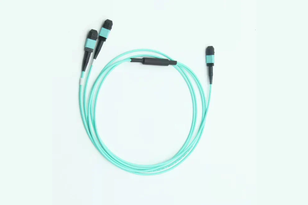 Aqua fiber optic breakout cable with MPO connectors showing multi-fiber connectivity solution for data centers