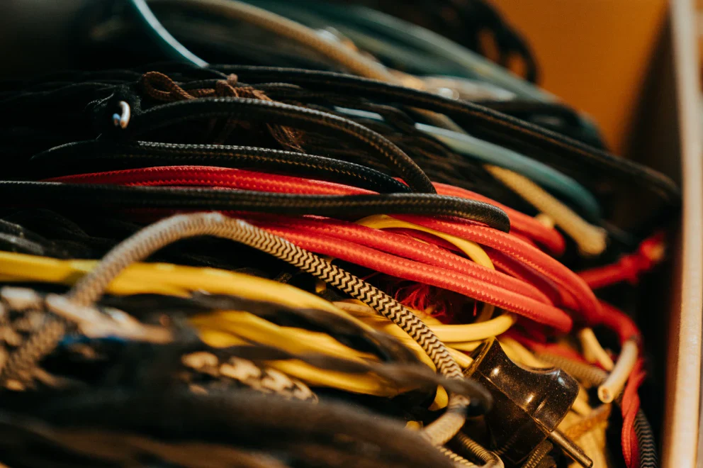 Bundle of multicolored copper and fiber cables showing different cable types used in video extender applications