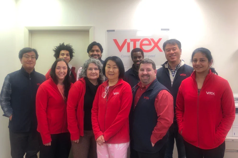 Vitex team members and fiber optic experts at company office - dedicated professionals providing technical support and quality optical solutions